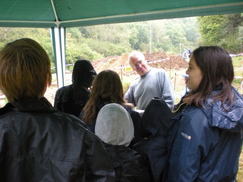 Phil and YAC members sheltering from the rain