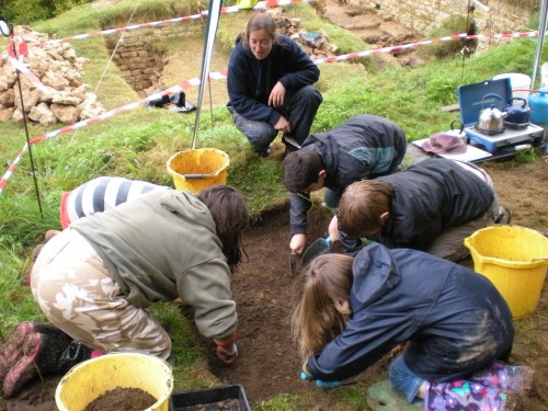 YAC members digging a test pit